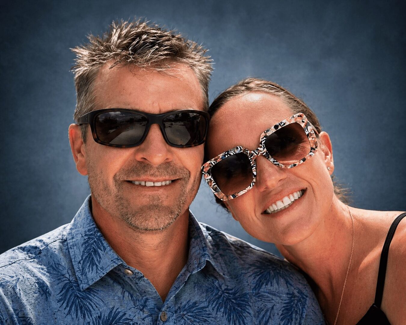 Couple enjoying stylish sunglasses