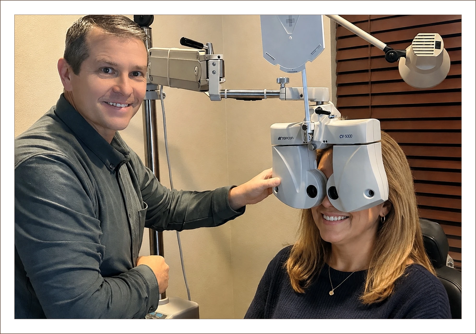 Patient undergoing vision testing with doctor