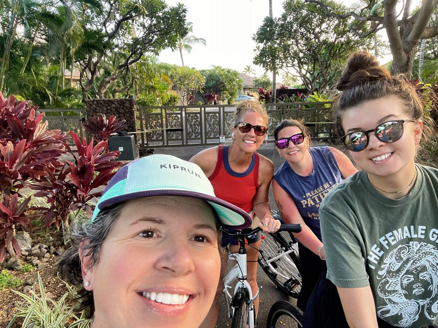Friends posing outdoors with bicycles