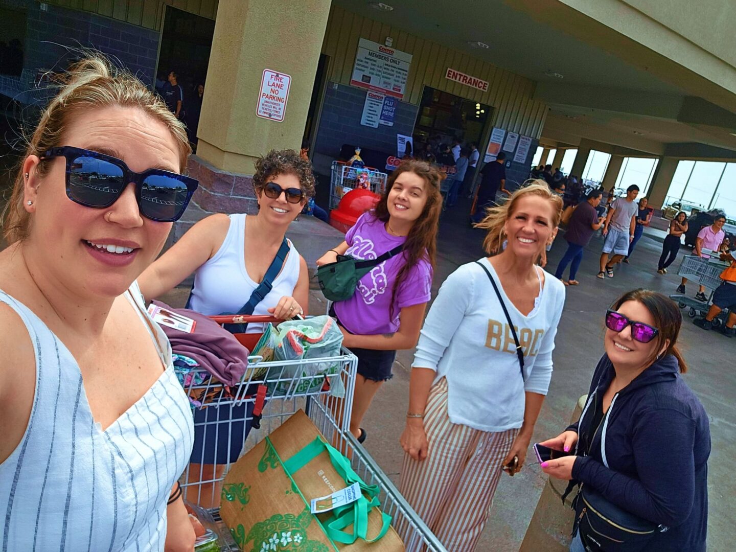 Women smiling with shopping carts