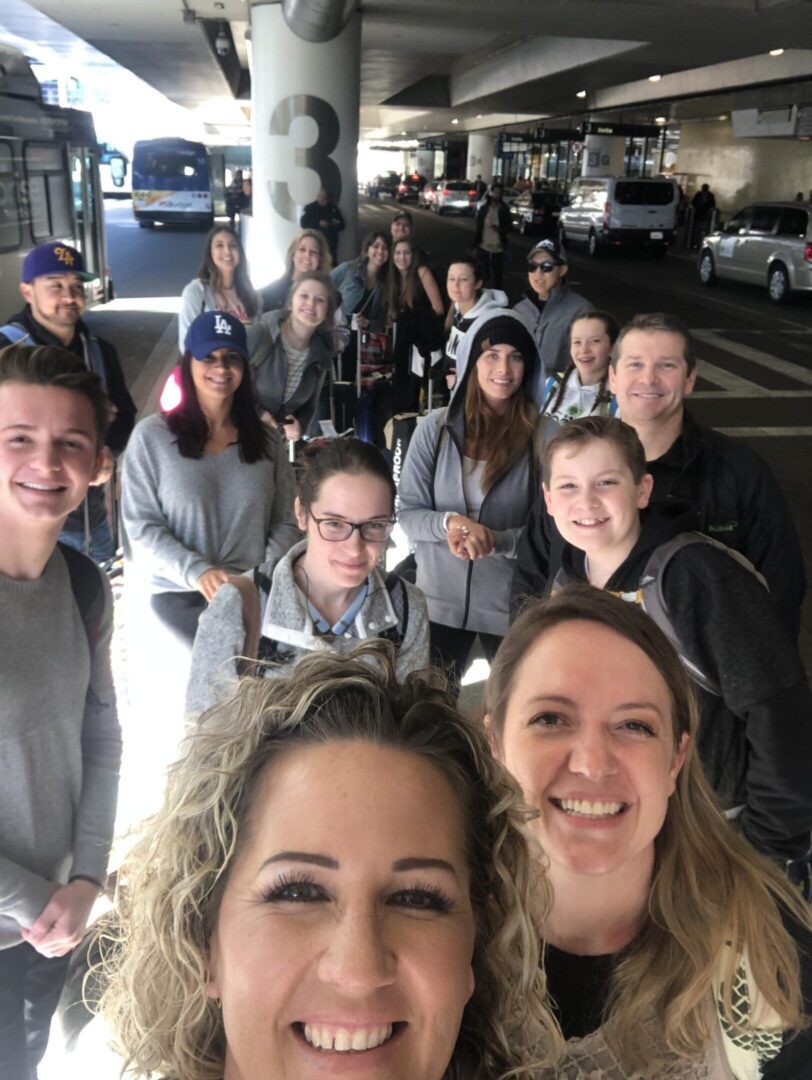 Friends gathered at airport entrance