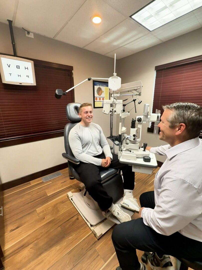 Optometrist conducting vision test