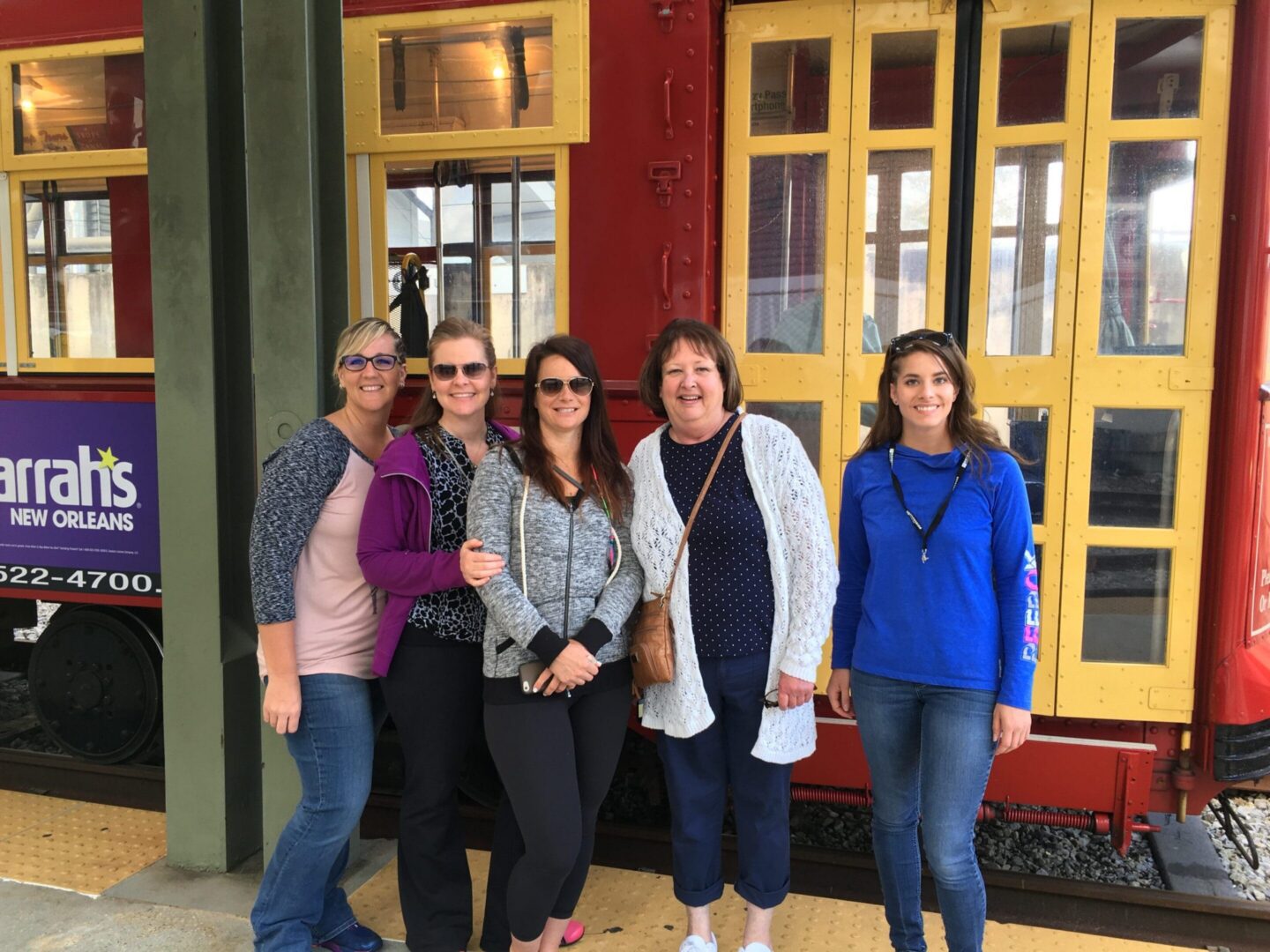 Women standing together near New Orleans tram
