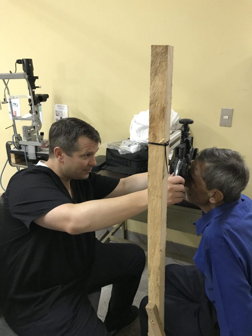 Eye examination with wooden barrier