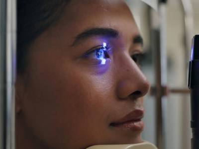 Person undergoing eye check-up procedure