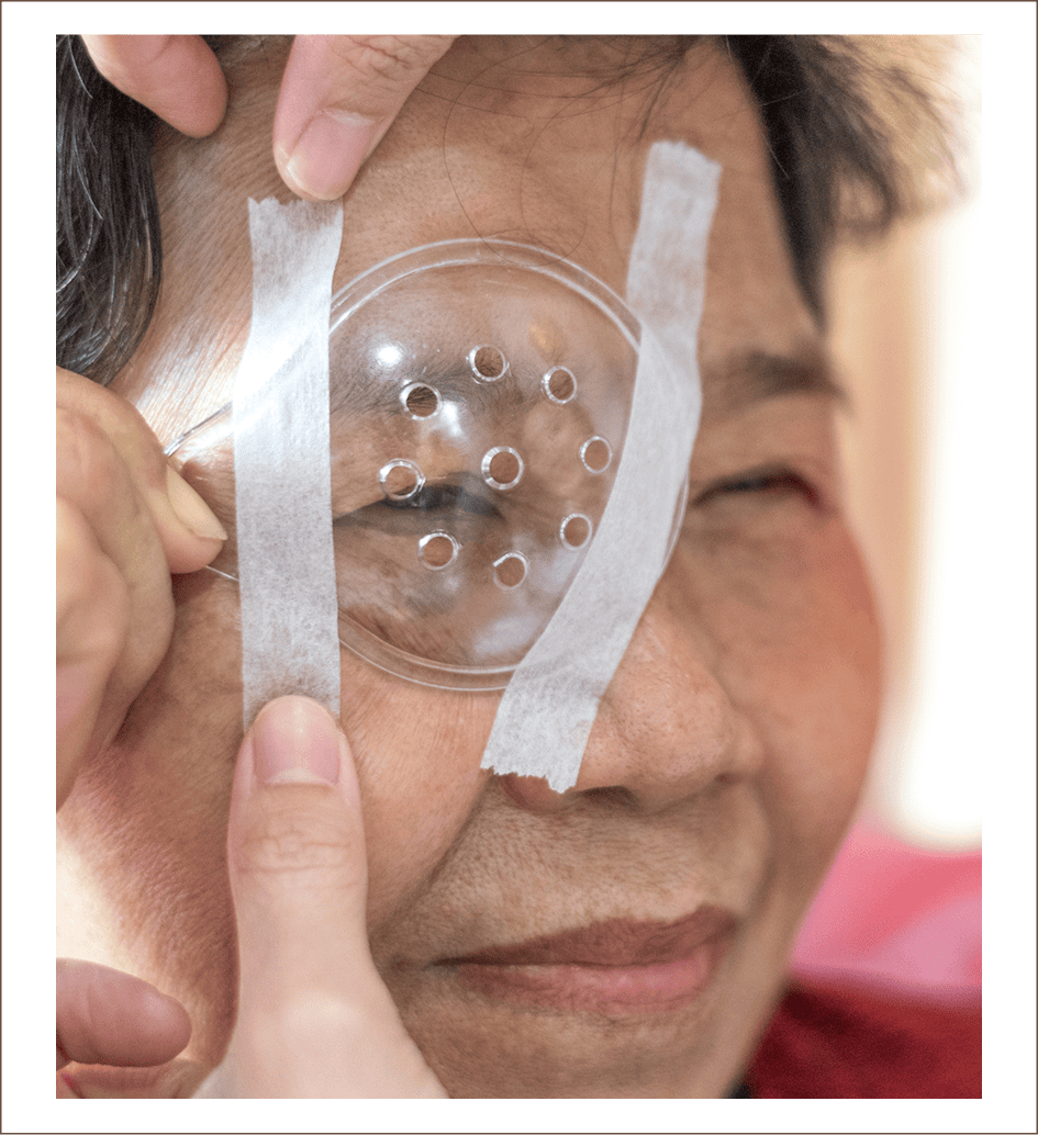 Patient with eye patch post treatment
