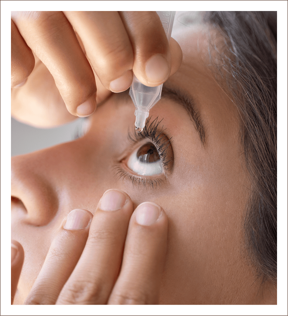 Close-up of eye drop application