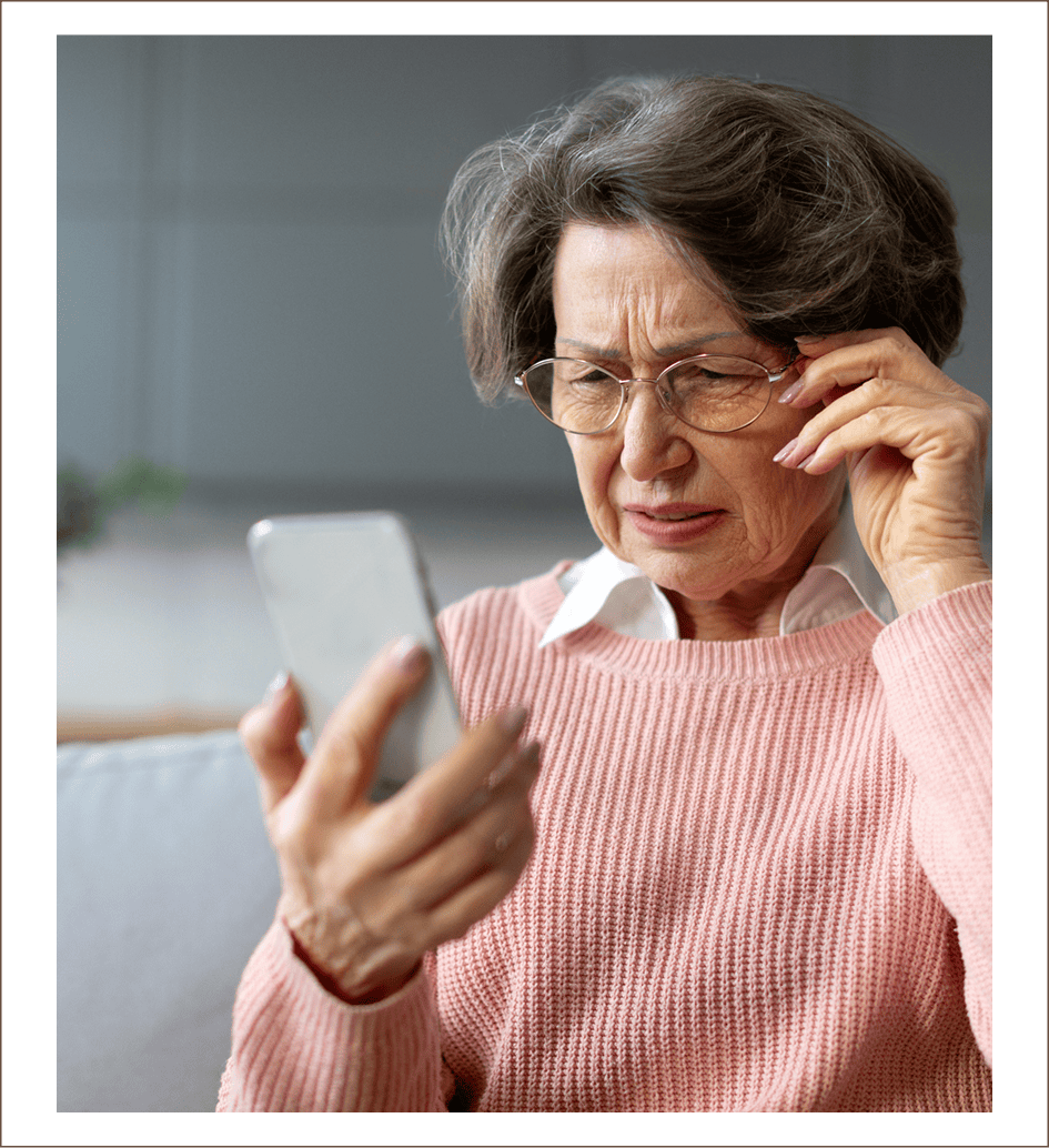 Older woman struggling with smartphone vision
